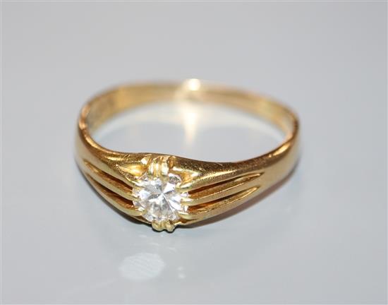 A George V 18ct gold and claw set solitaire diamond ring, the stone weighing approximately 0.50cts, size V.